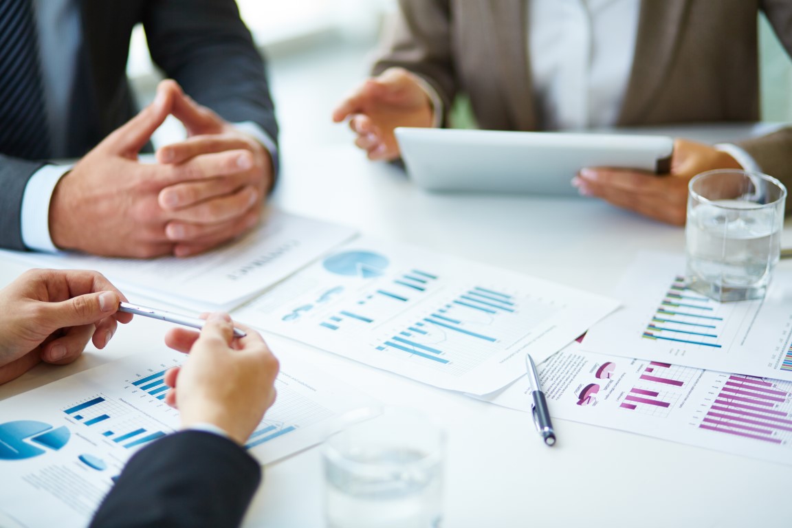 Objects at workplace Image of business documents, pen and glasses on workplace during meeting of partners
