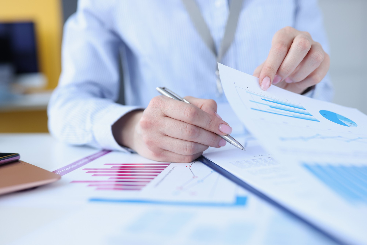 woman-signing-document-with-graphs-with-ballpoint-pen-closeup (1) woman-signing-document-with-graphs-with-ballpoint-pen-closeup (1)
